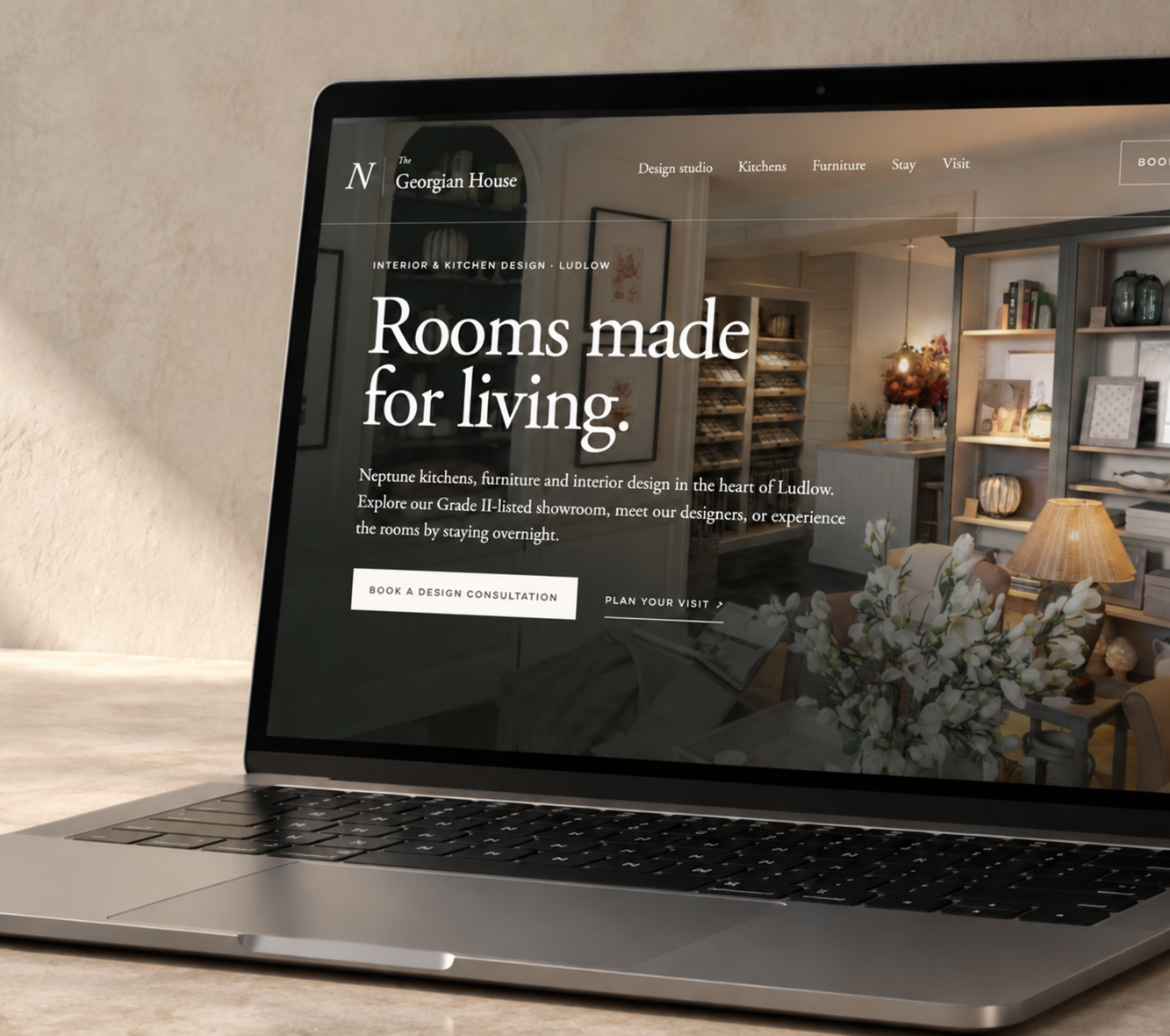 The Georgian House website displayed on a laptop
