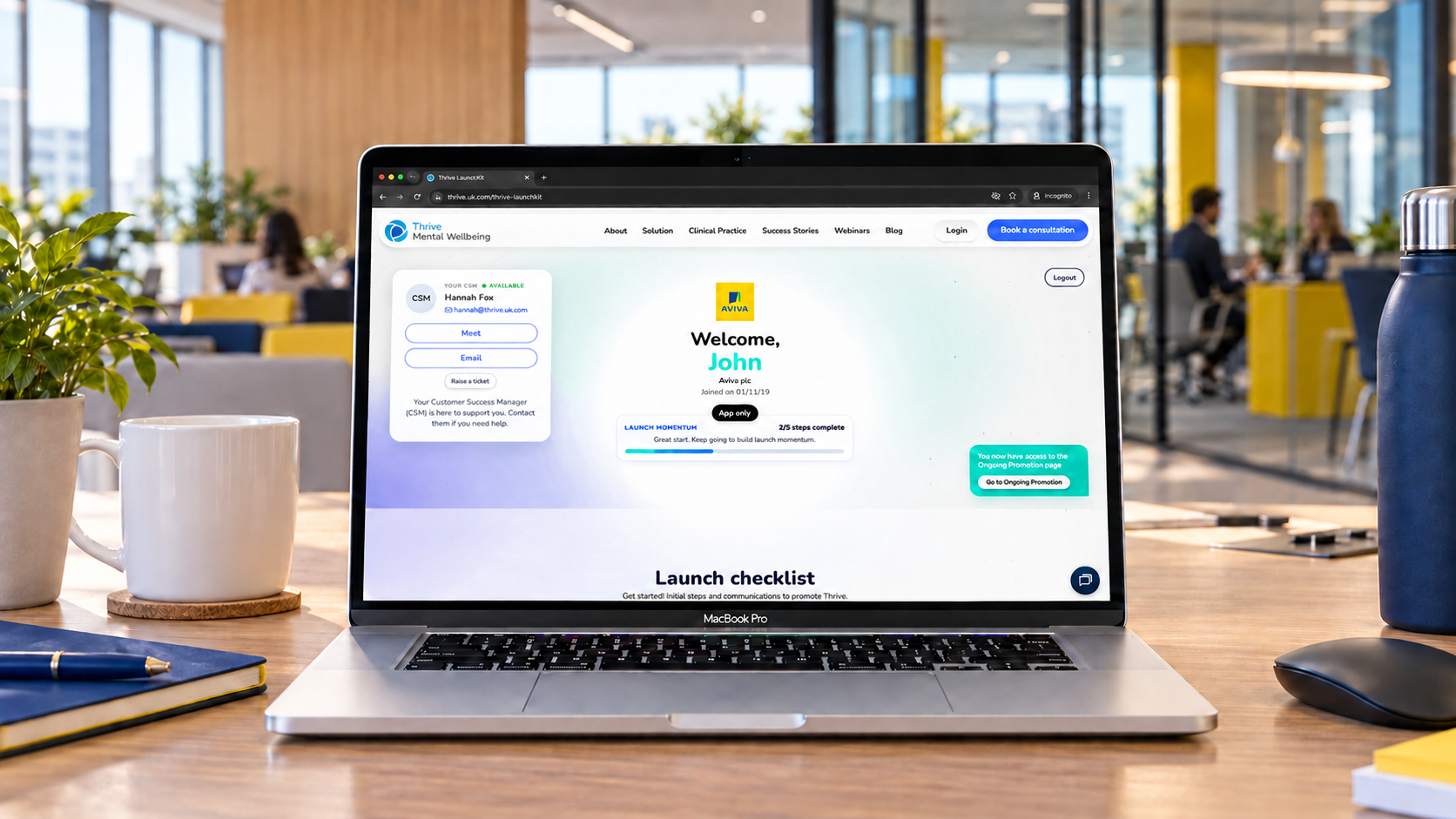 Personalised Aviva Thrive LaunchKit experience welcoming John on a laptop in a contemporary workplace