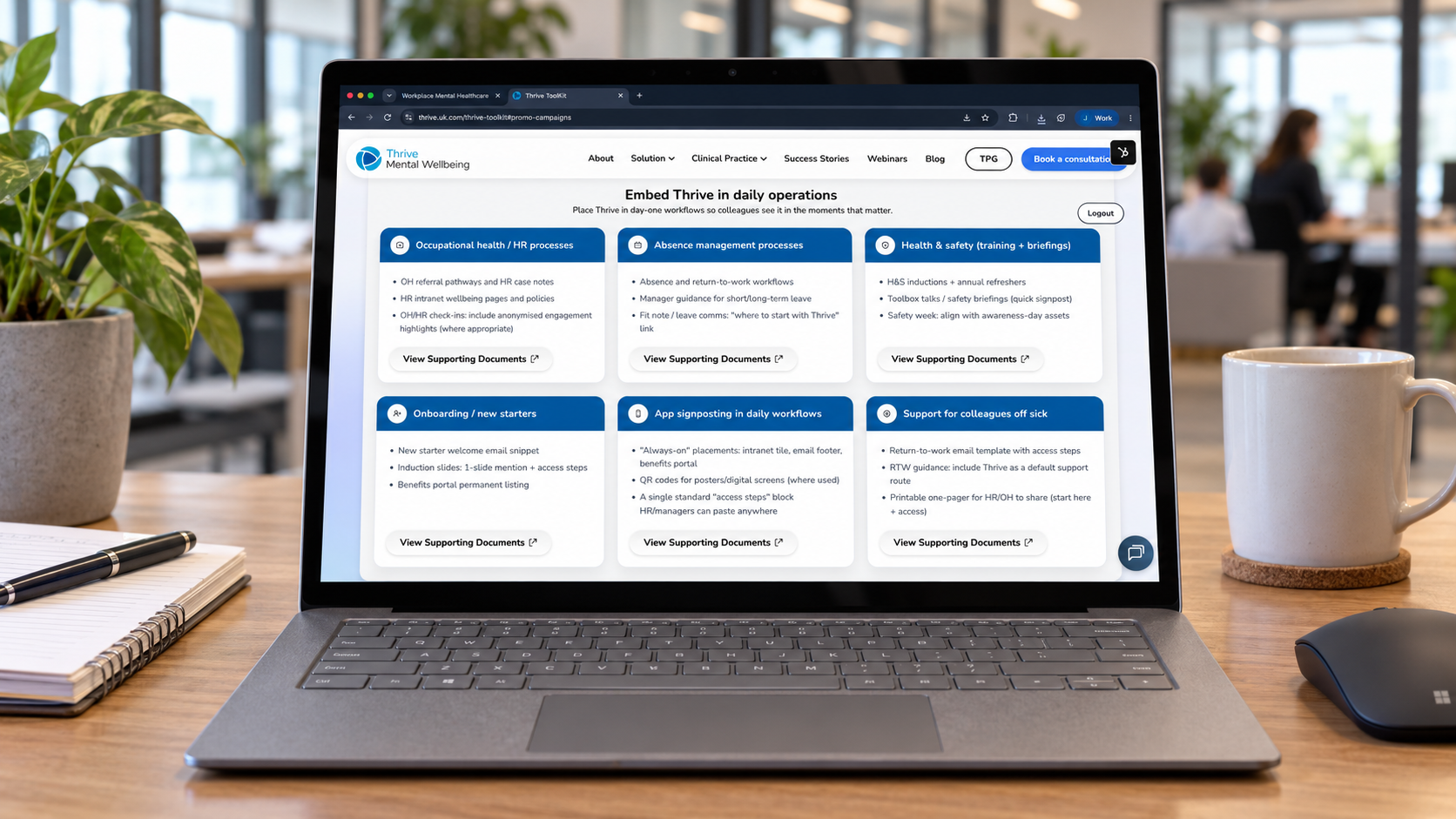 Thrive daily operations guidance displayed on a Microsoft Surface laptop in a workplace office
